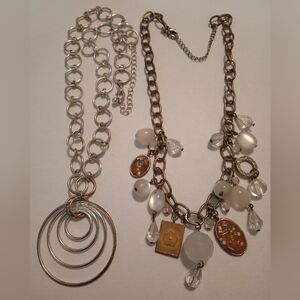 #570.  2 Piece Silver Toned & Tan Enameled Charm Necklace Bundle